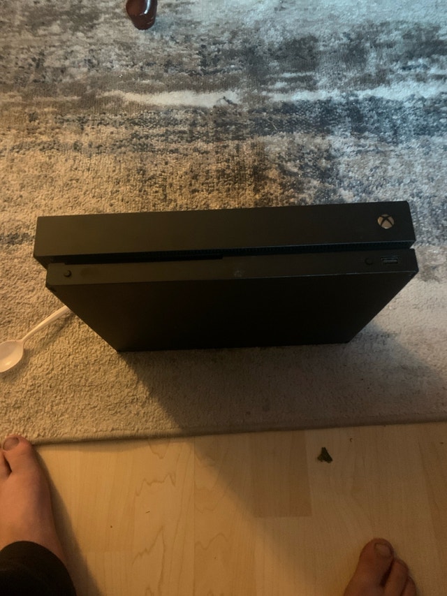 Xbox one x used good condition with cords and wired controller