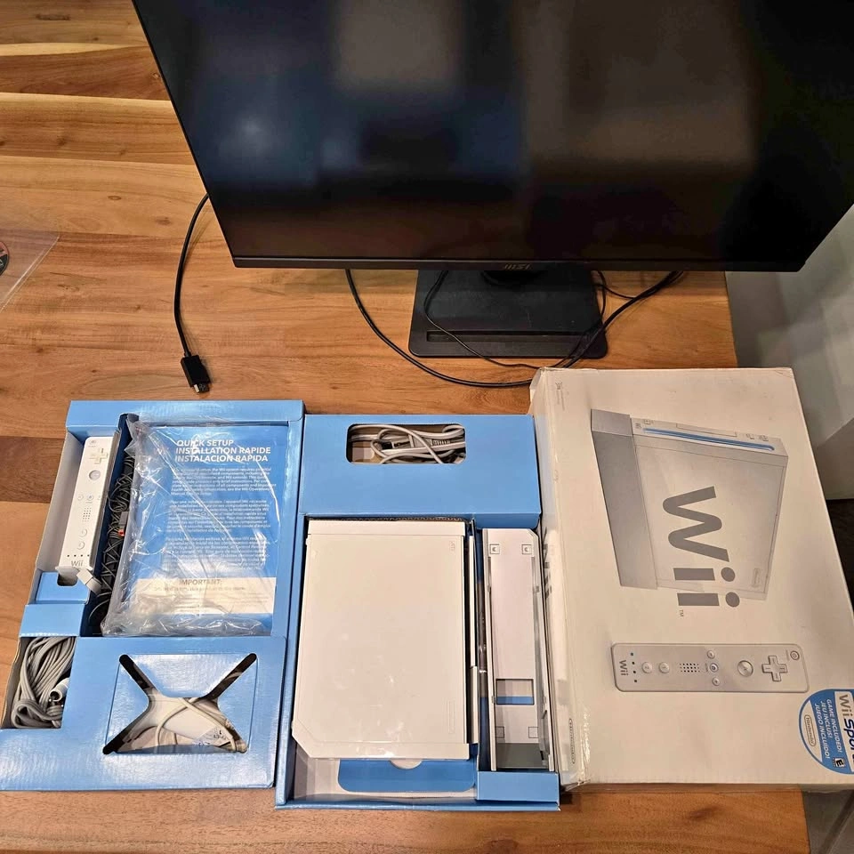 Nintendo Wii in box with accessories. No issues.