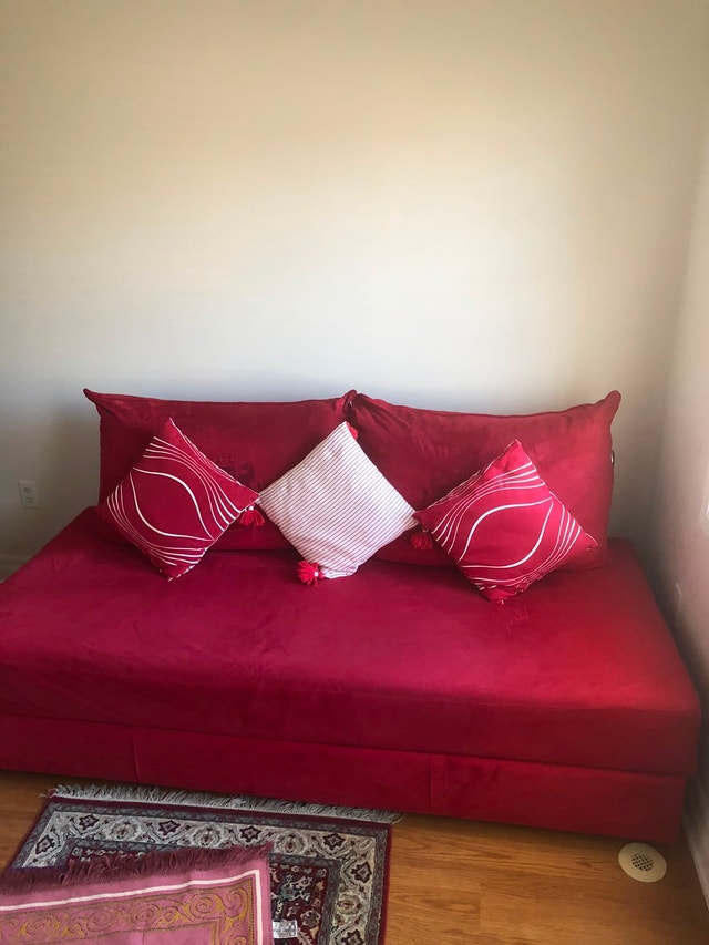 Red Sofa which converts to a bed