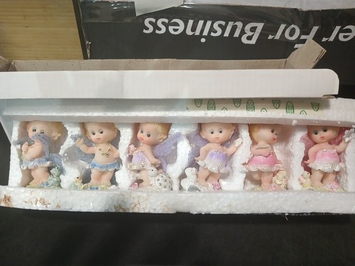 Two Sets Of vintage miniature porcelain baby figurine