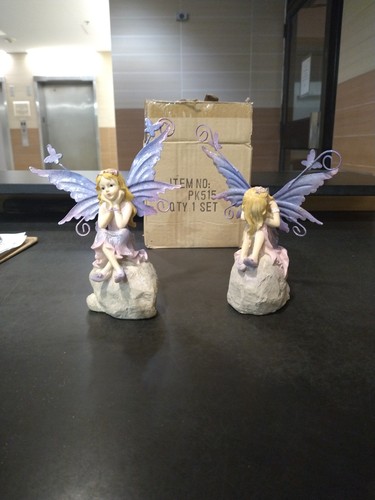 Two Sets Of angel statues