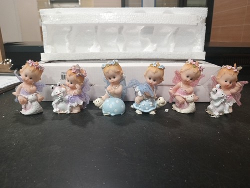 Two Sets Of Miniature Polyresin Baby Fairy Or Baby Angel Figurin