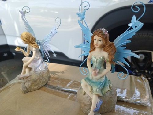Two Angel Sitting On The Miracle Rocks