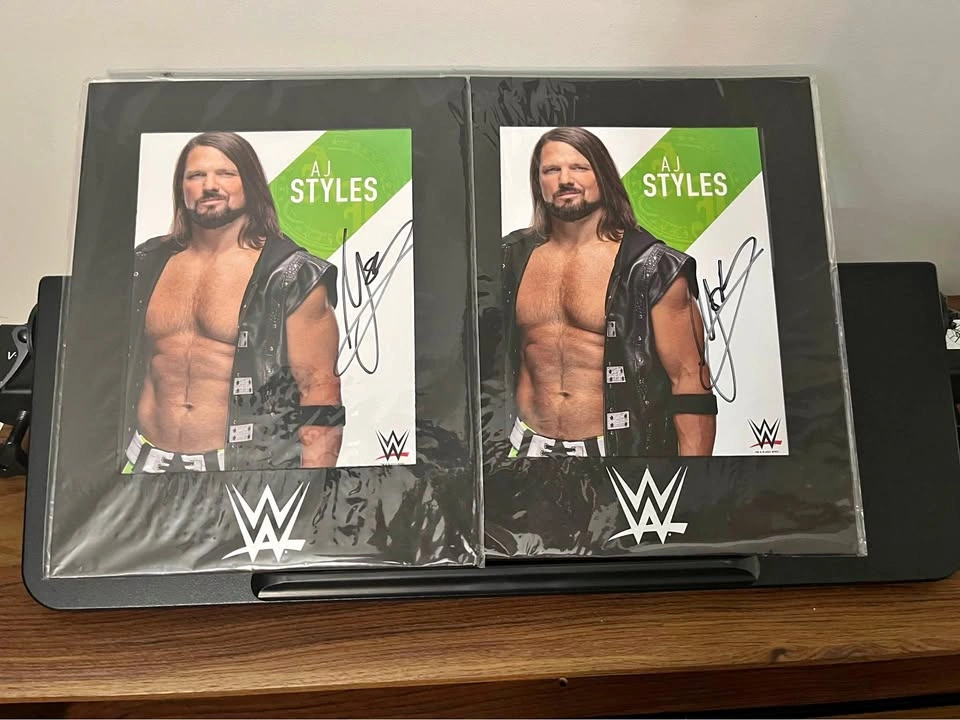 Two AJ Styles signed WWE promotional photos