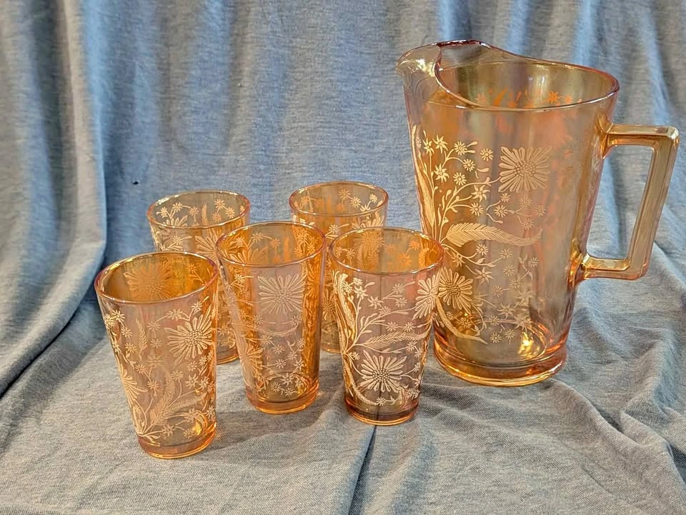 Vintage carnival glass pitcher and cups