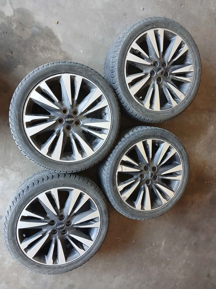 Set of 5x108 Lincoln Rims on 245/40R19 Nokian Winter Tires