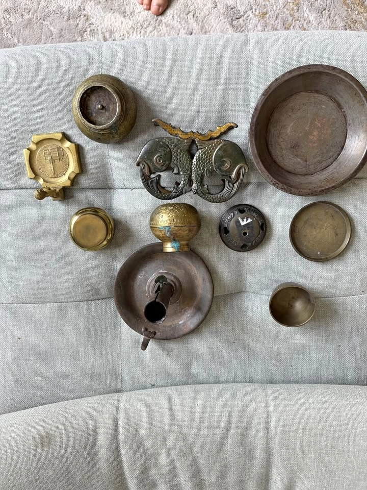 Set of metal brass vintage items: plates, ash bowls, candlestick