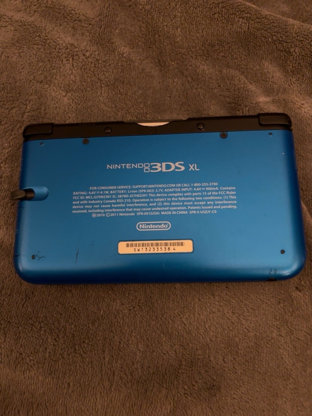 Nintendo 3DS XL with charger, case and 22 games - photo 2