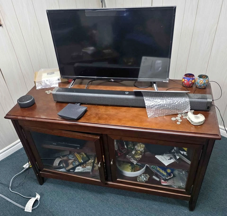 Roku TV, Sound Bar, and TV Stand