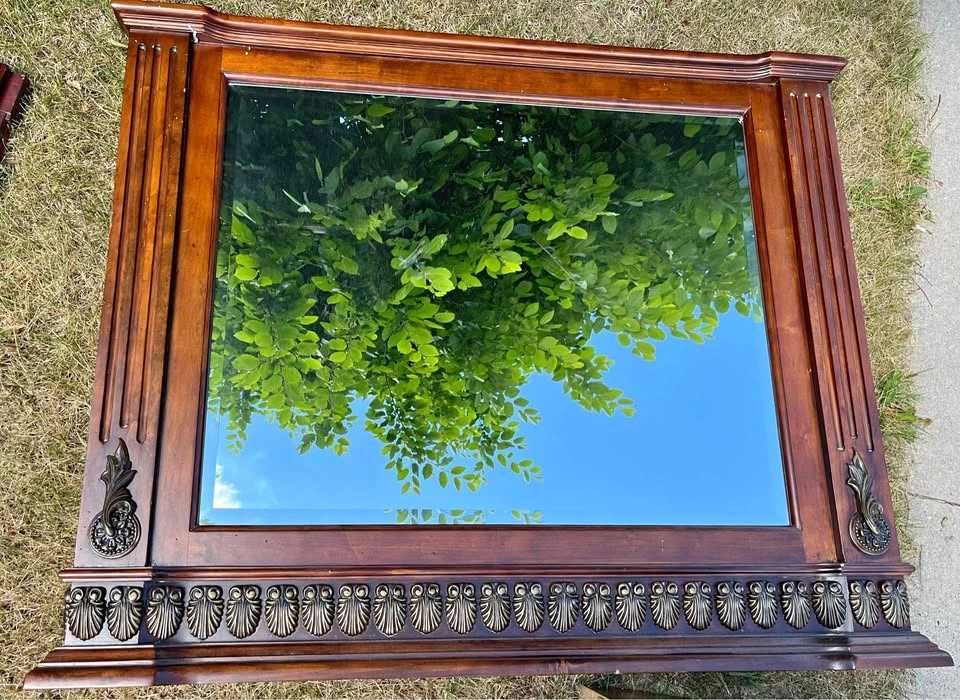 Bevelled mirror with walnut frame