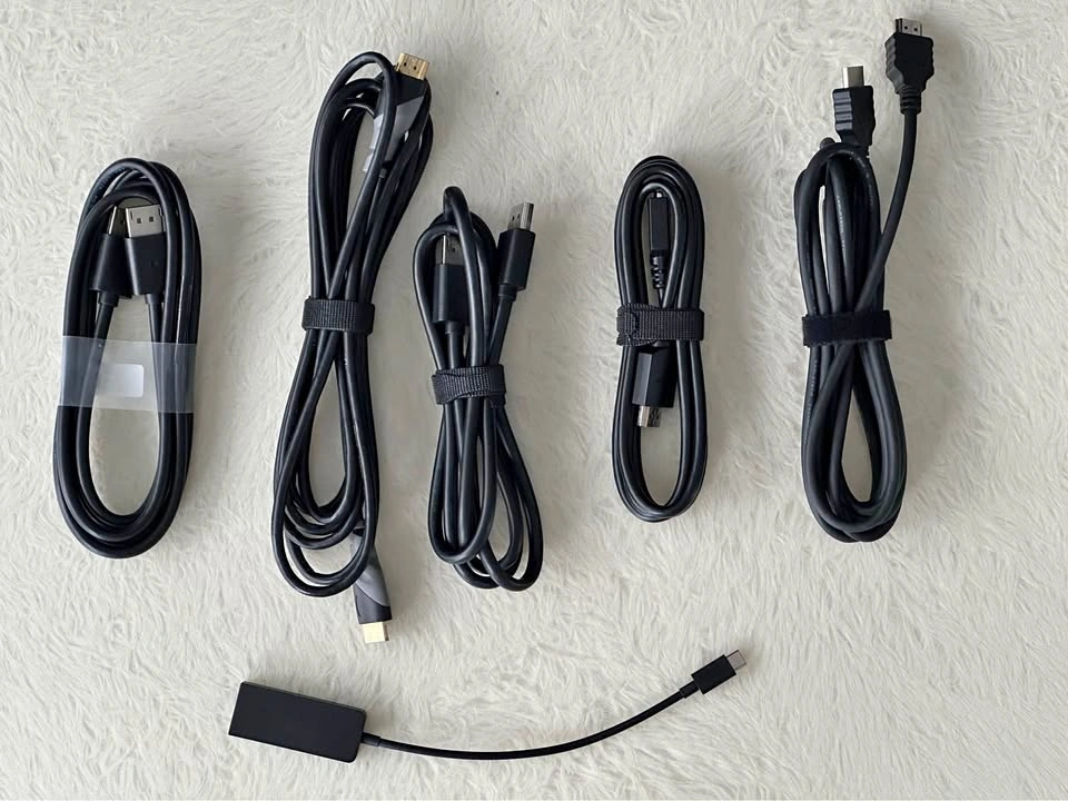 Assorted HDMI, DisplayPort cables, and an HDMI to USB-C adapter
