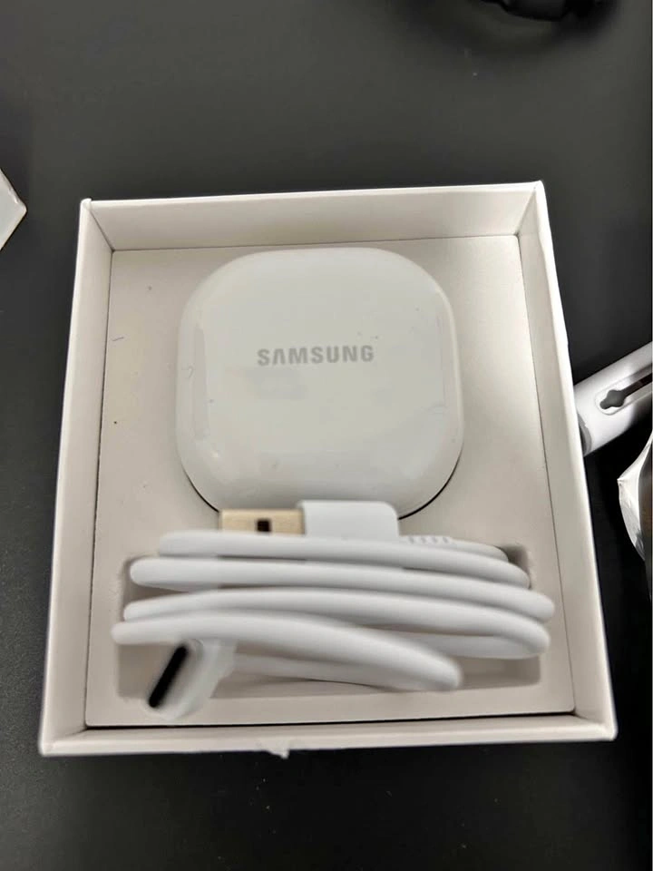 Samsung Galaxy Buds2 with two cases and cleaning tool