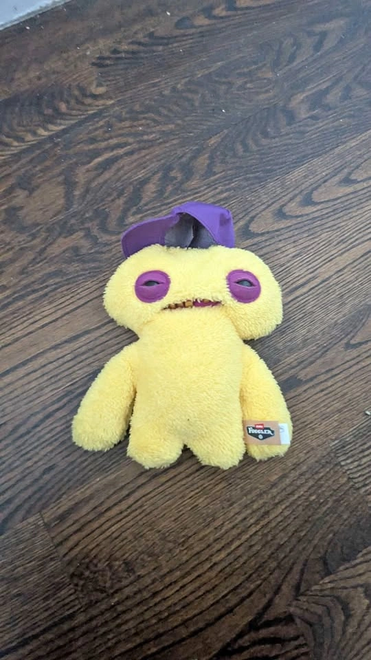 Yellow Fuggler with purple hat