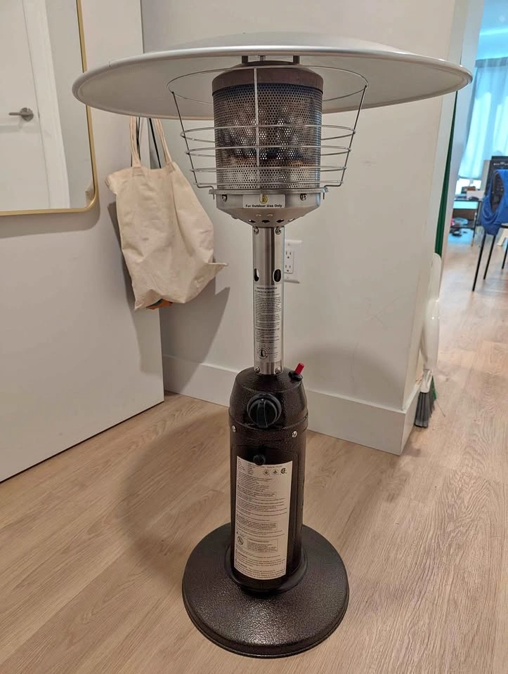 Tabletop patio heater with cover and propane cylinder