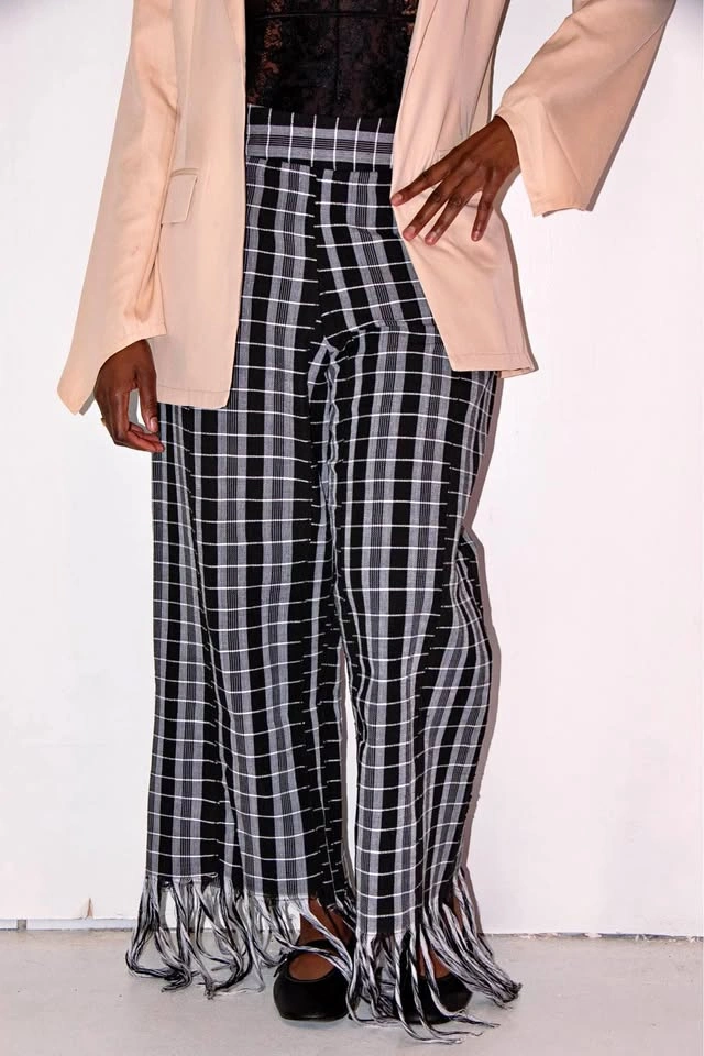Black and white pants with fringe at bottom