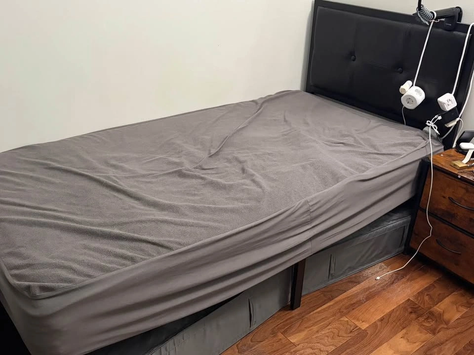Twin bed + black metal bed frame