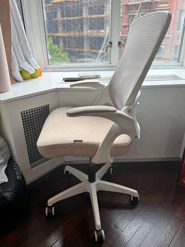 Beige desk chair with back support and adjustable height