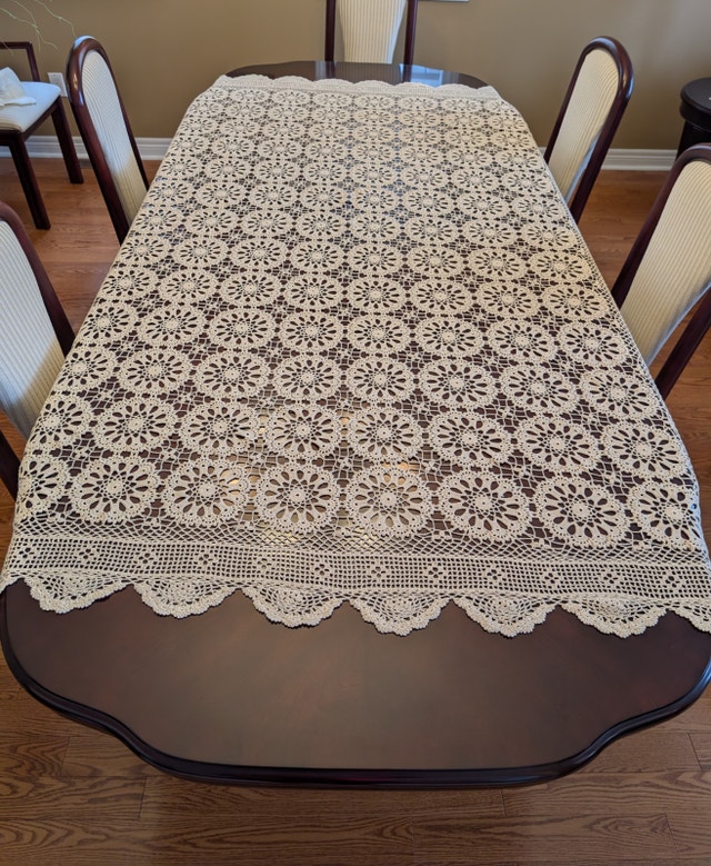 Handmade crochet tablecloth with scalloped edge
