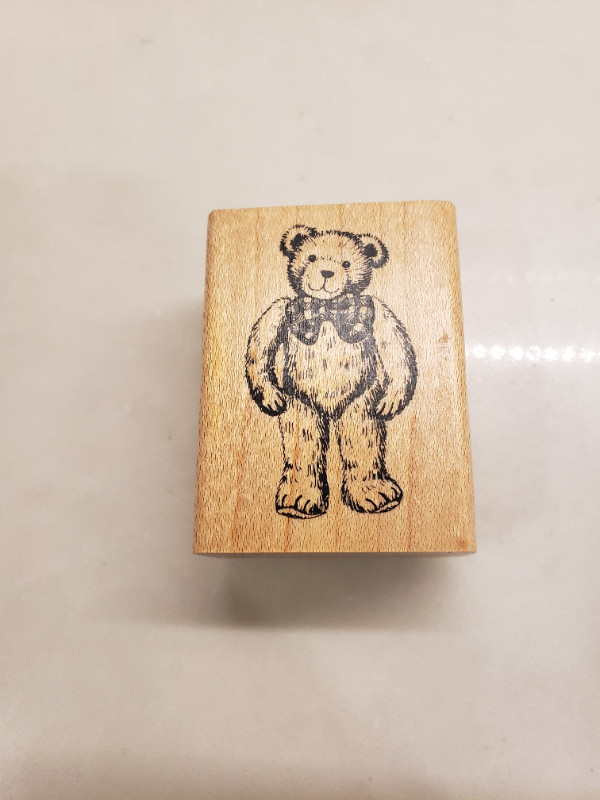 Delafield Stamp Company Teddy Bear with bow stamp E455
