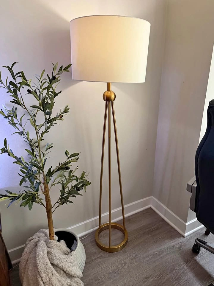 Gold tripod floor lamp