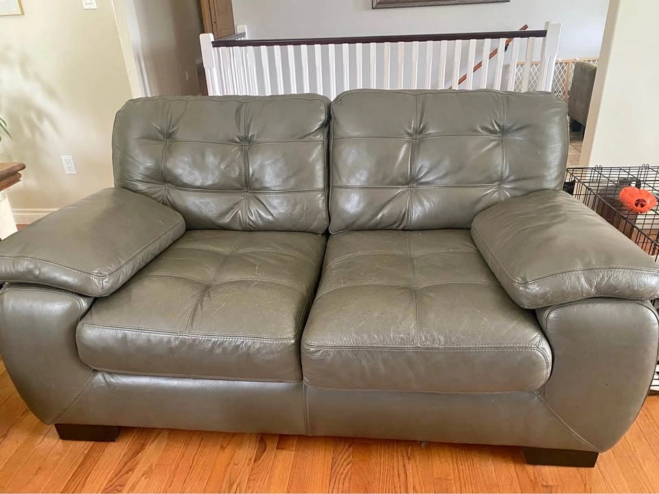 Leather love seat. Quality Simon Li design fine furniture.