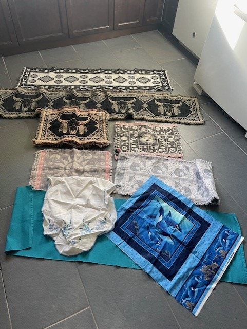 10 cloth place mats, 4 runners and dolphin material