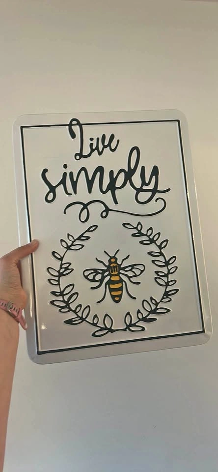 “Live simply” decorative metal plaque wall art