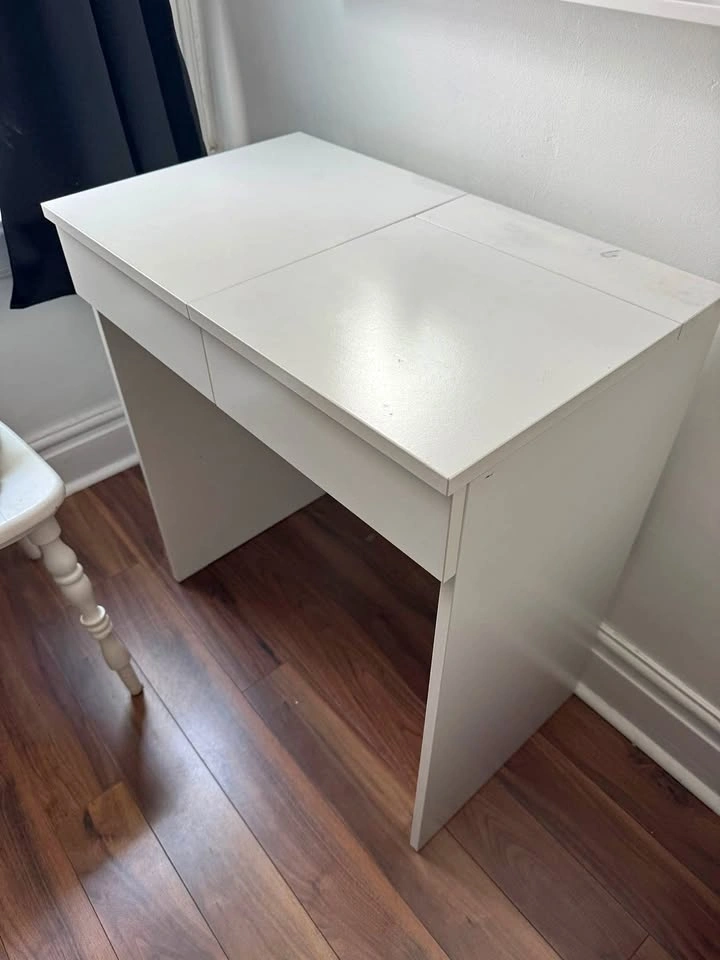 Small white vanity with mirror and storage