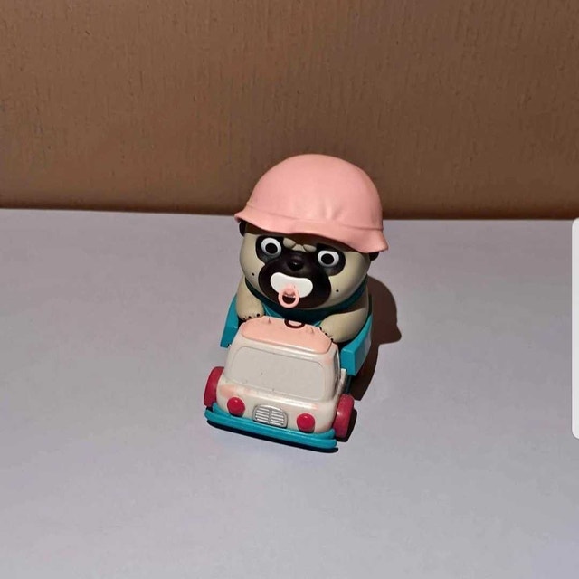 Mini Pug on Milk Scooter Figurine