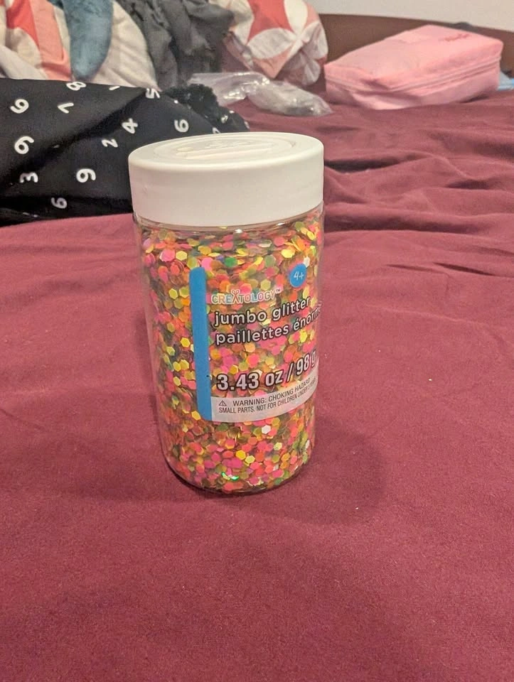 Bottle of multicoloured jumbo glitter