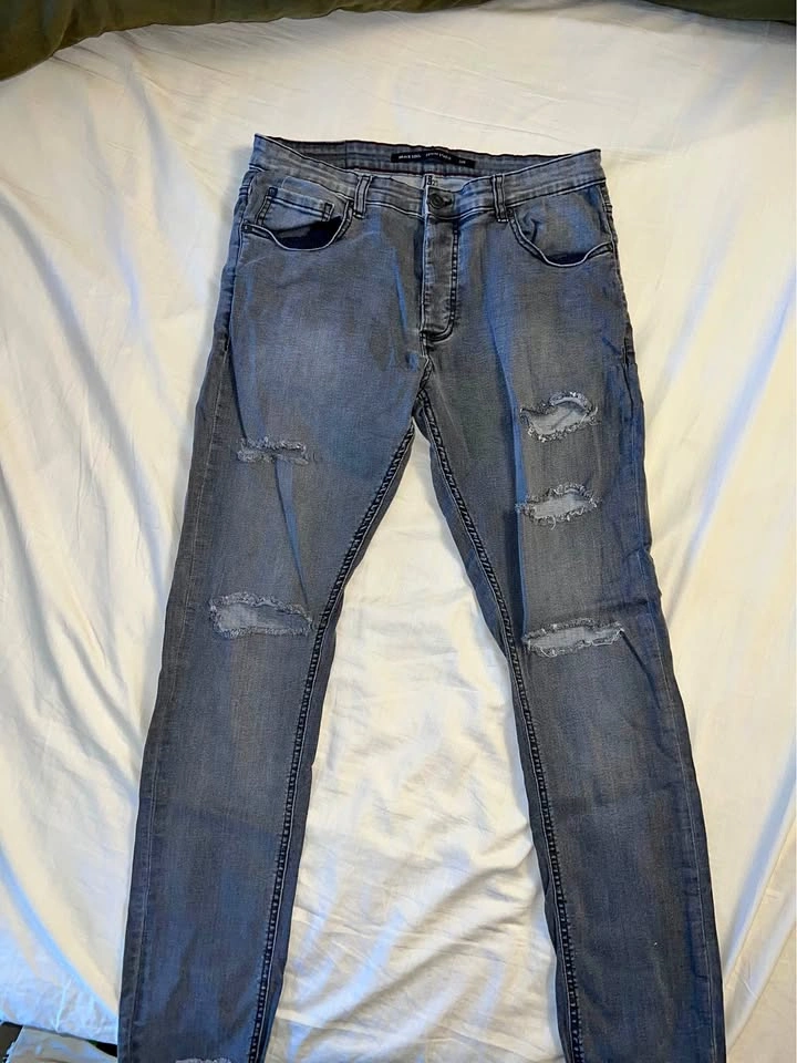 Vintage black ripped jeans, size 32