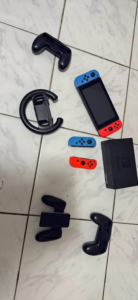 Nintendo Switch and Accessories with Extra Controllers