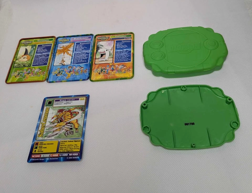 Vintage Digimon Metal Collector Tins, SaberLeomon Card, and Stor - photo 2