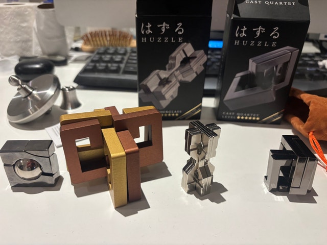 Collection of mechanical puzzles / brain teasers