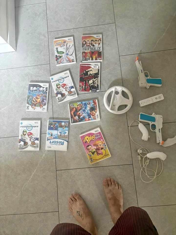 Nintendo Wii Game & Accessory Bundle – Mario Kart, Remotes, Guns