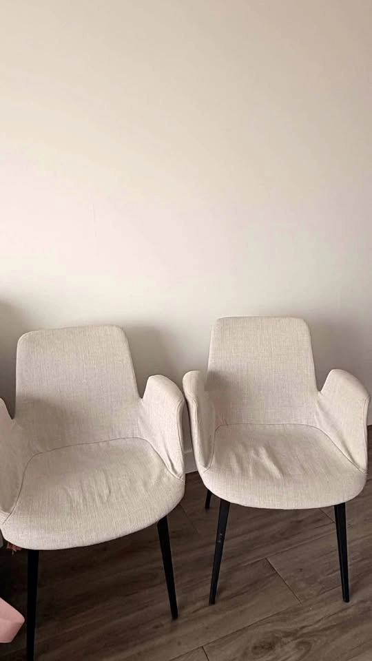 Pair of Beige Upholstered Armchairs with Black Metal Legs