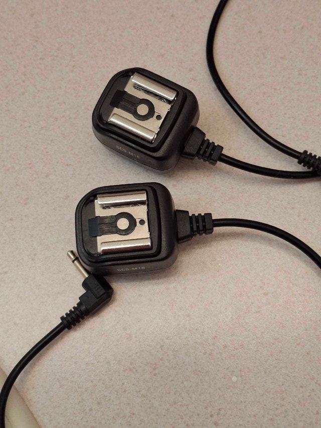 A set of 2 flash synchronization cables