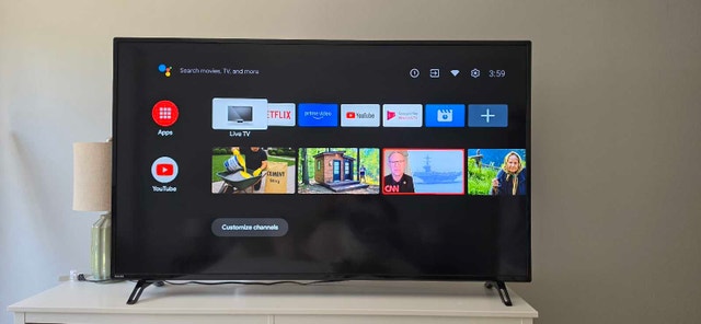 Philips 65PFL5766/F6 TV and TCL soundbar - photo 2