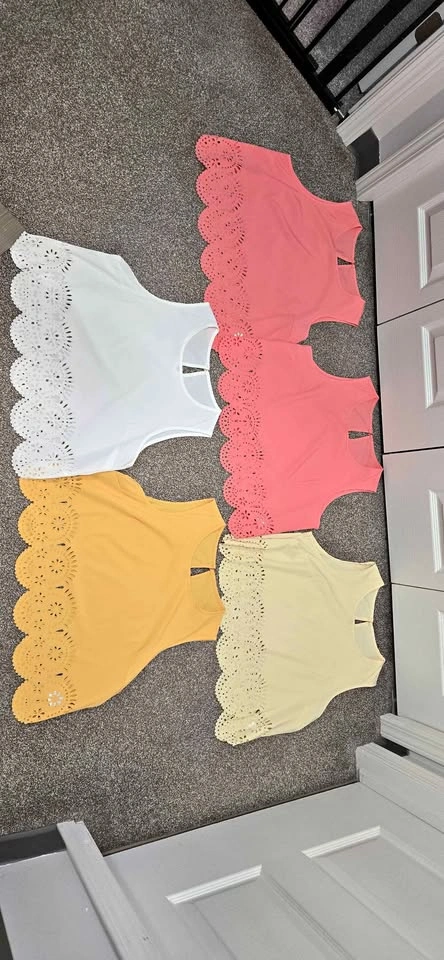 Women's elegant solid color sleeveless shirt with lace cut out