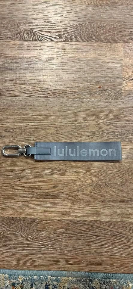 Grey Lululemon keychain tag