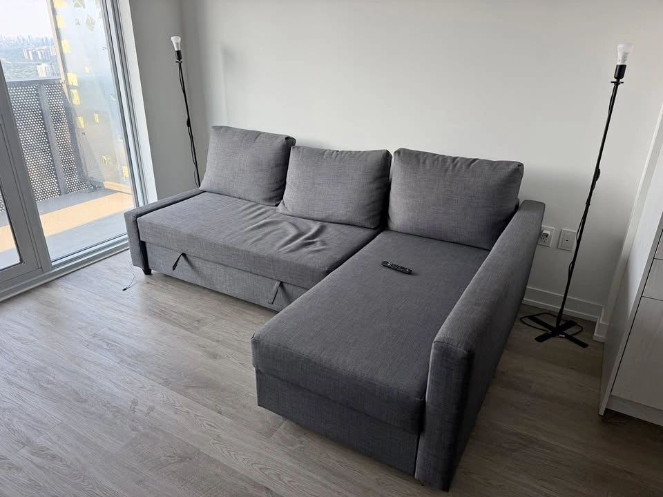 FRIHETEN: Corner sofa-bed with storage, dark gray, IKEA