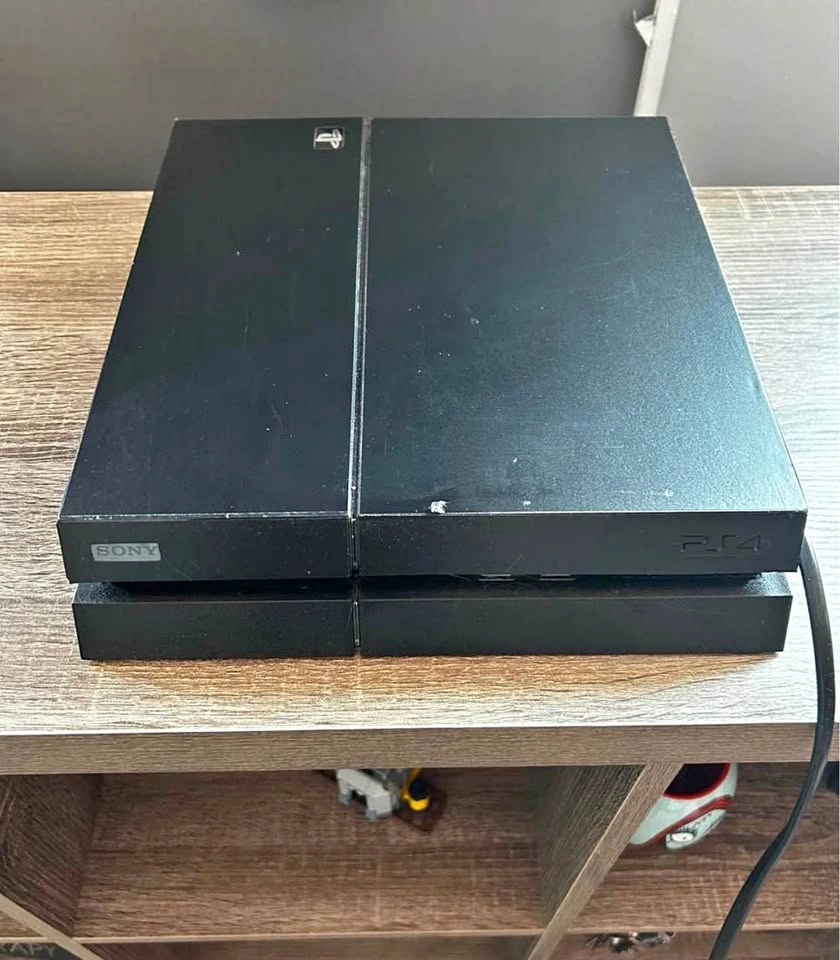 Sony PlayStation 4 Console with Controller and 2 Games