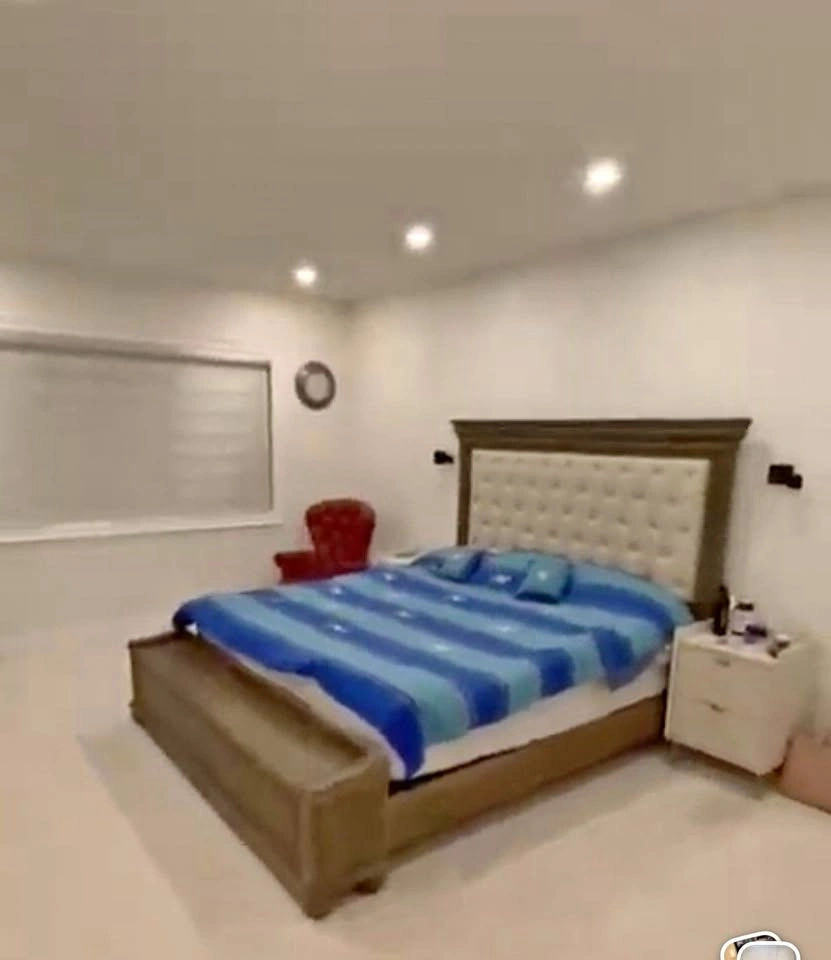 Ashley Johnelle King Bed with Tufted Headboard & Storage