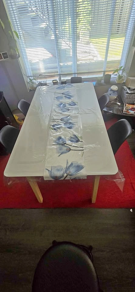 Sturdy White Dining Table with 4 Black Chairs and a stool