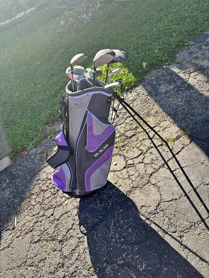 Women’s Ram Purple Standing golf bag with various clubs