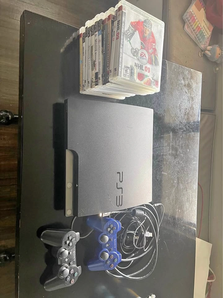 Sony PlayStation PS3 with 2 controllers + 11 games