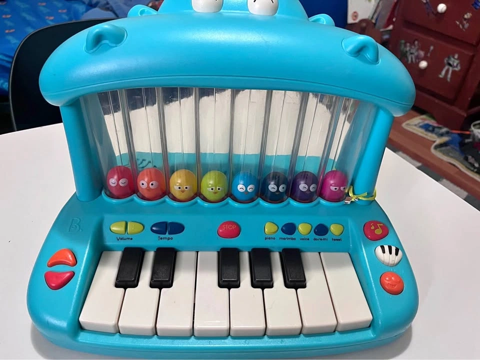 B. toys Hippo Pop Musical Toy Keyboard with Lights, Songs and Bi