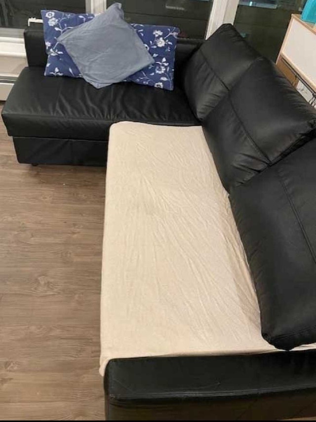 IKEA leather couch that turns into a bed - photo 2