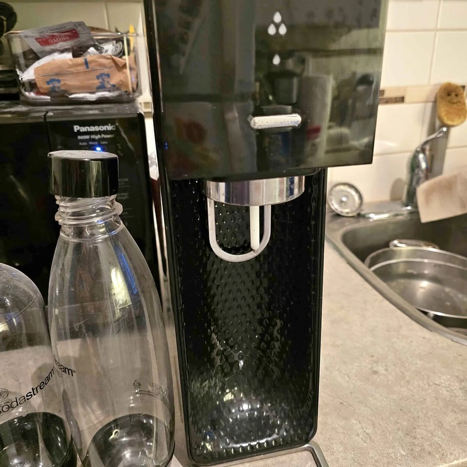 SodaStream sparkling water maker + 4 bottles