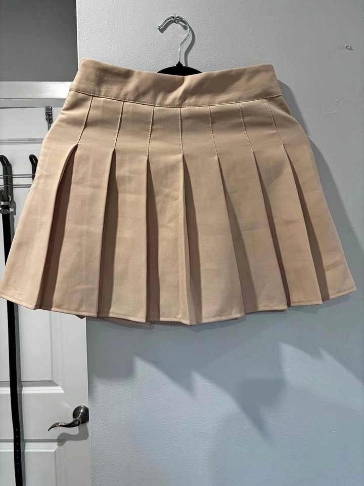 Women or girl’s apricot peachy cream pleated skirt